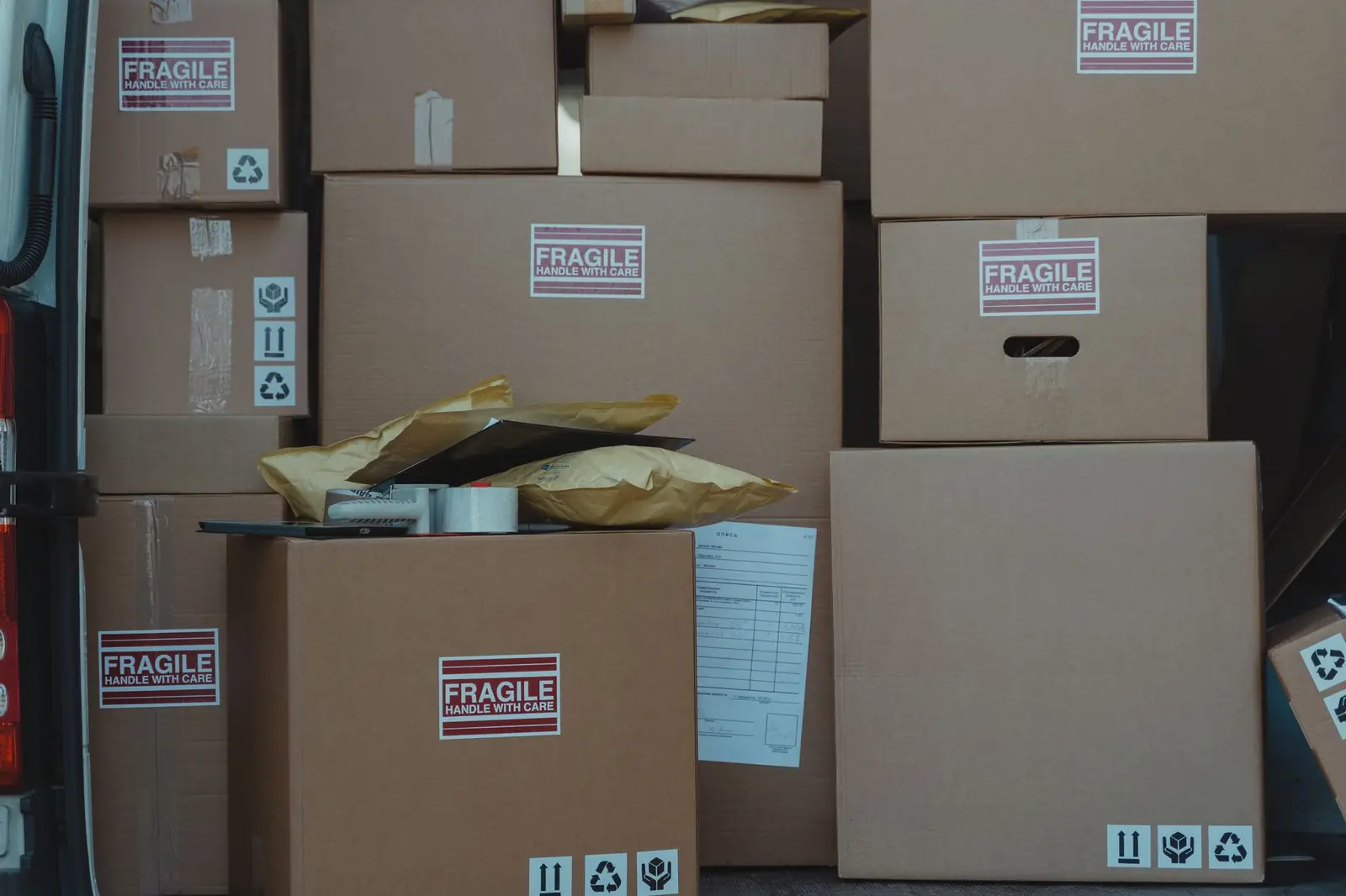 Stacked cartons marked fragile ready to ship