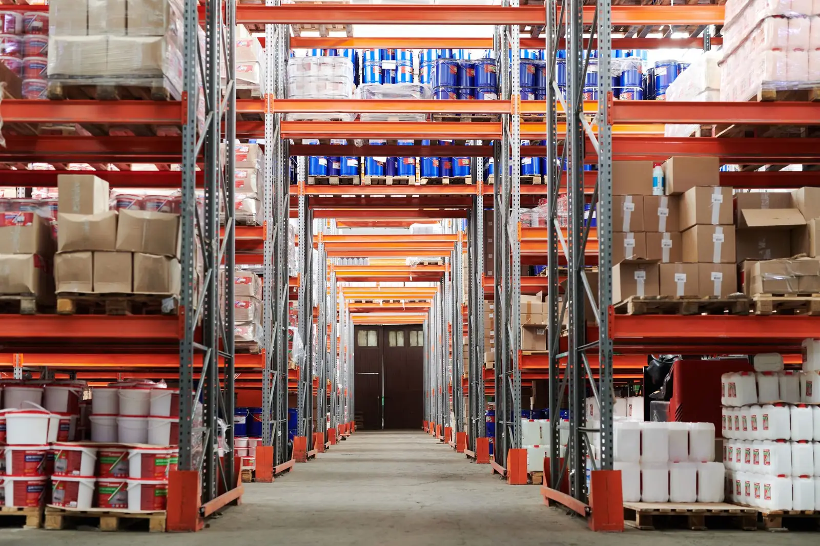Warehouse aisle with pallet racking stocked with cartons