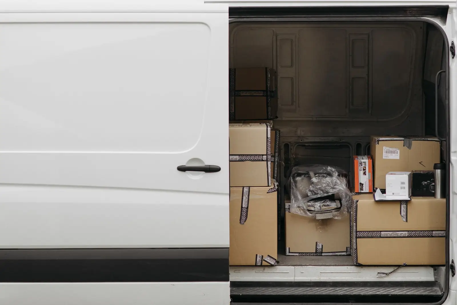 Open delivery van loaded with parcels