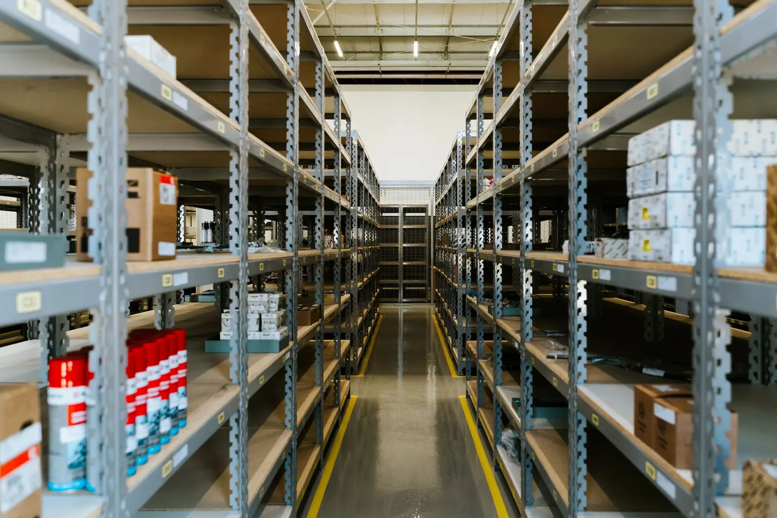 Warehouse shelving aisle with organized inventory