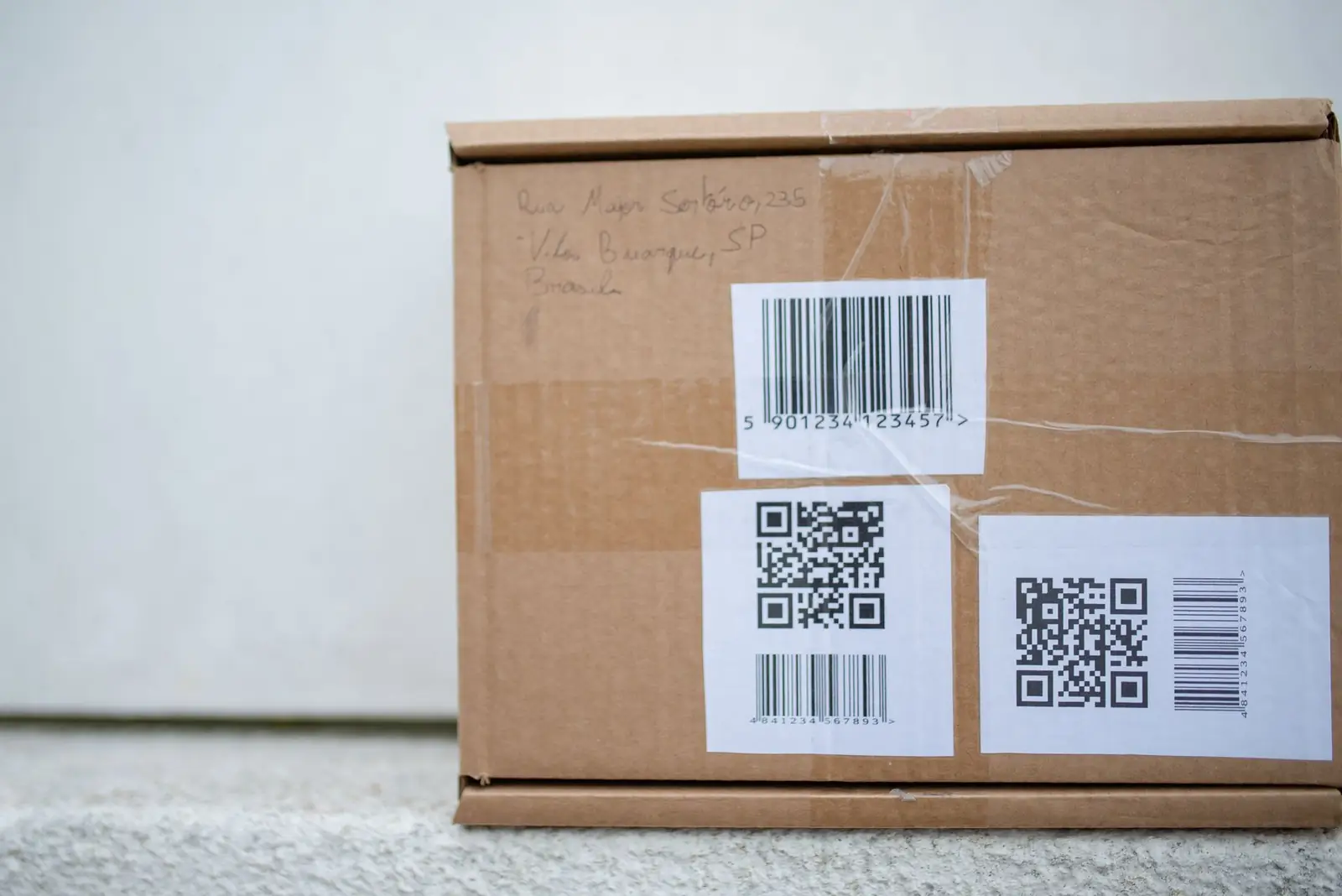 Shipping box with barcode and tracking labels