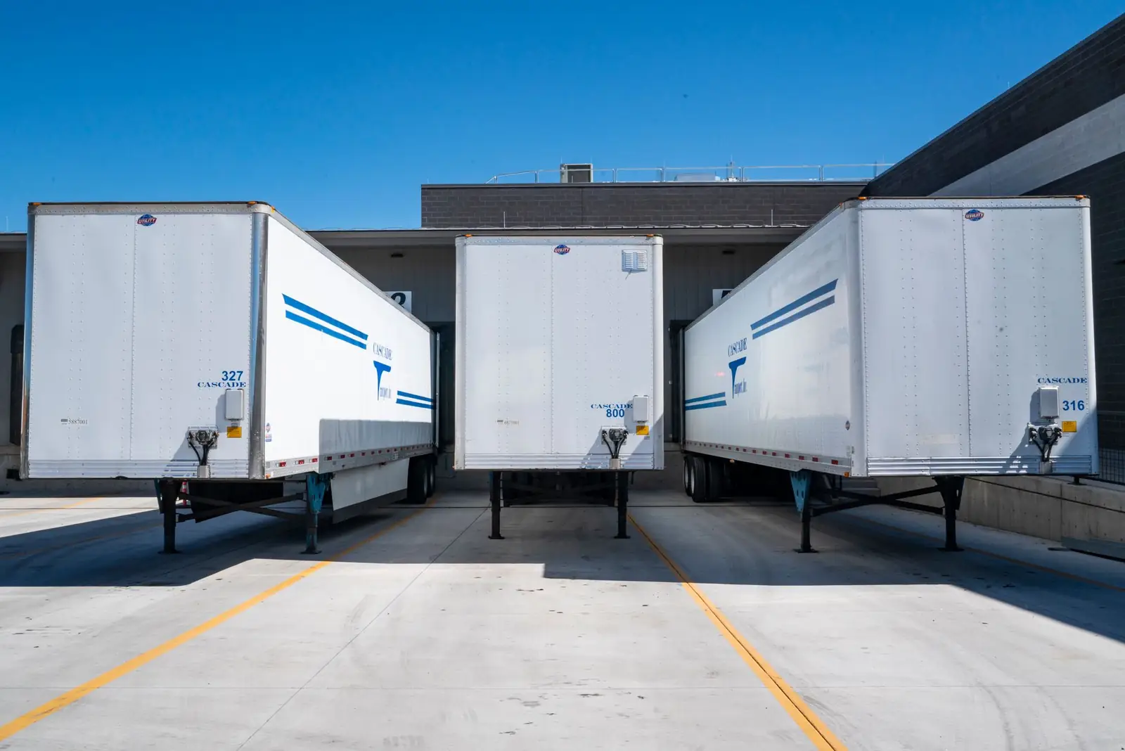 Trailers backed into warehouse loading docks
