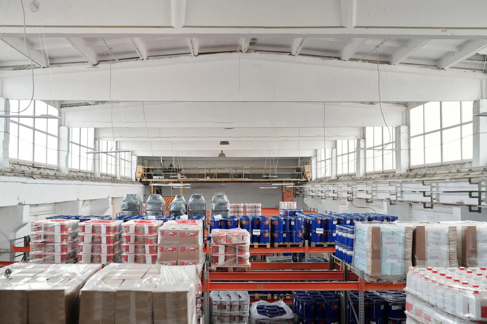 Distribution warehouse with racks of palletized, cased product