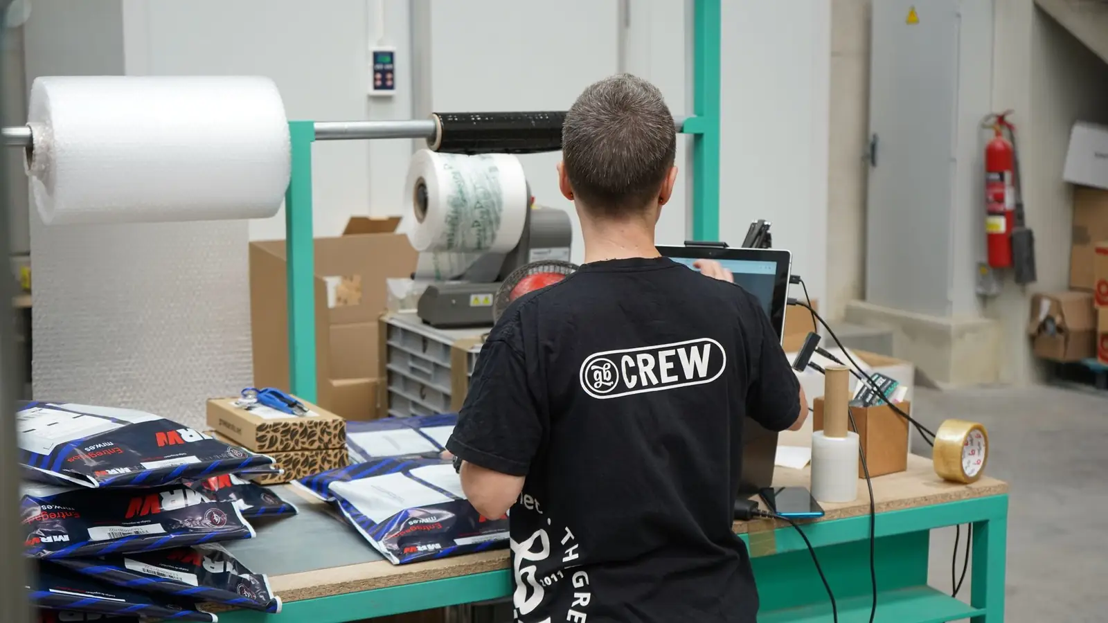Packing station with poly mailers, bubble wrap and a label printer